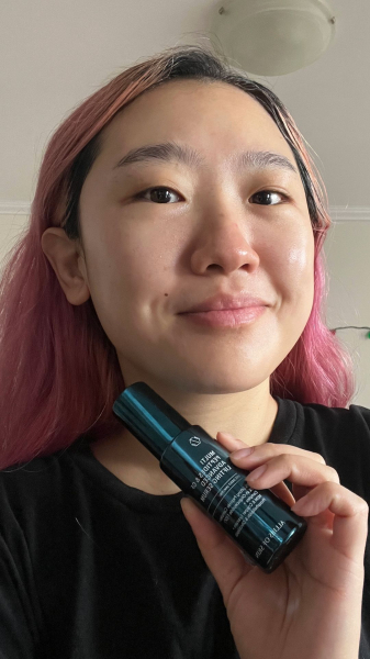 A photo of Allure commerce editor Sarah Han after applying Allies of Skin Multi Peptides GF Advanced Lifting Serum
