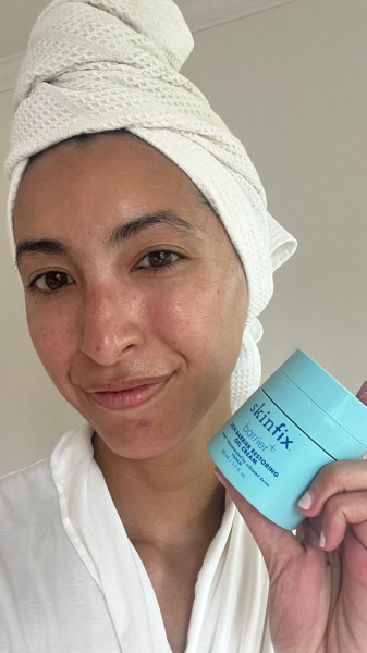 A selfie of Allure contributing commerce editor Deanna Pai after applying Skinfix Barrier Restoring Gel Cream